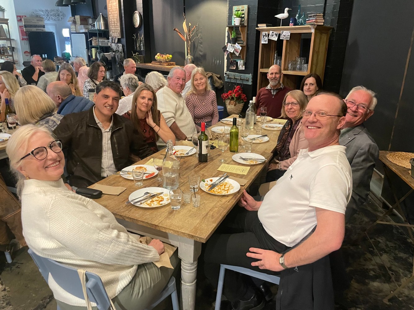 a group of people sitting at a table